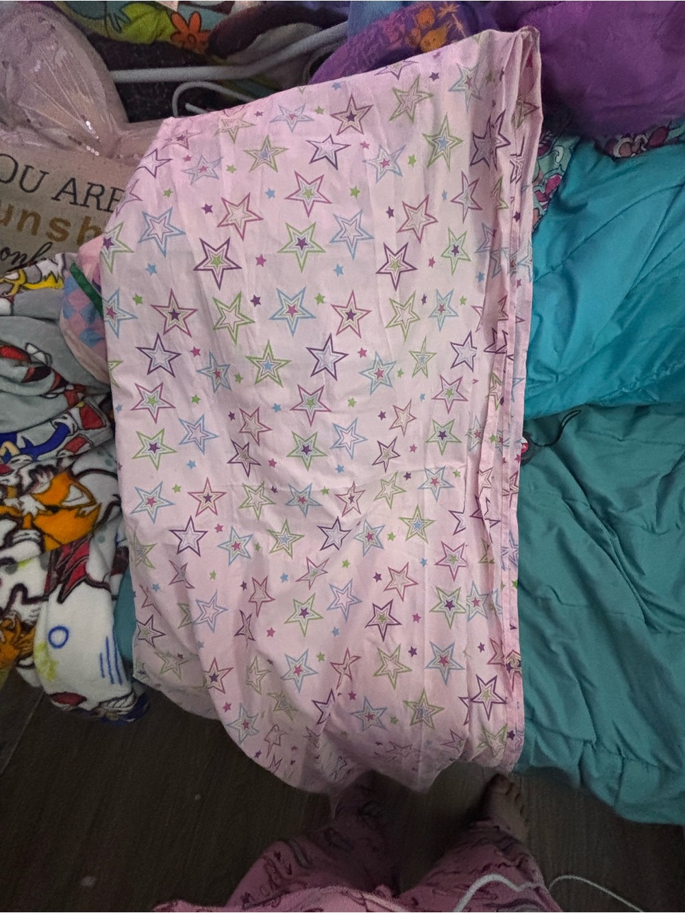 Pink bedsheet with multicolored stars
